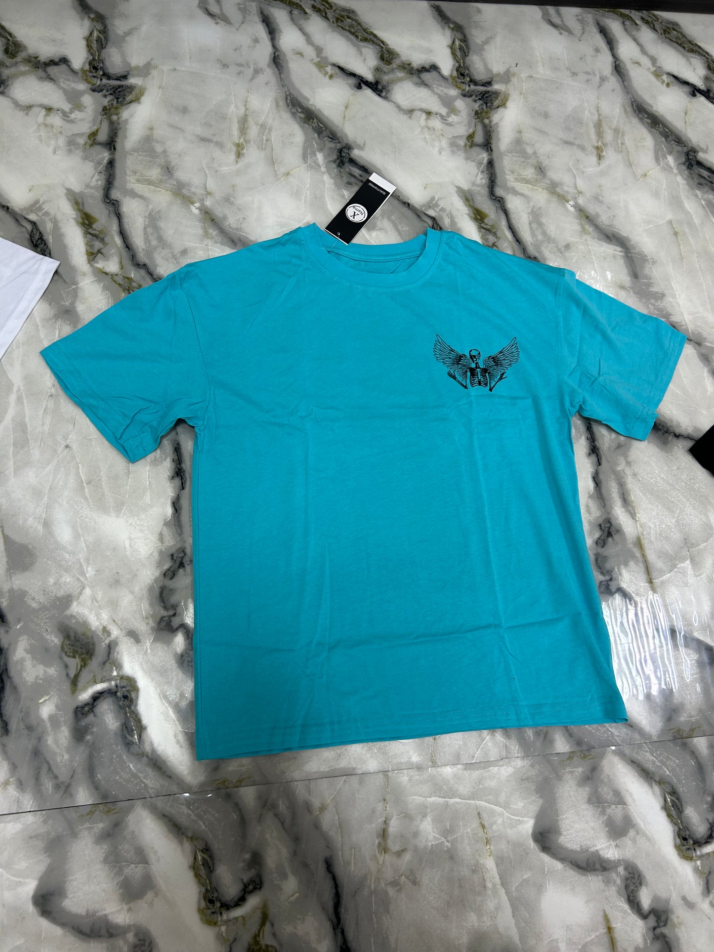 T shirt X name con teschio ali azzurro